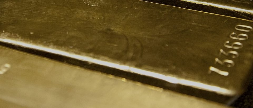Gold bars seen close up, their faces catching the light